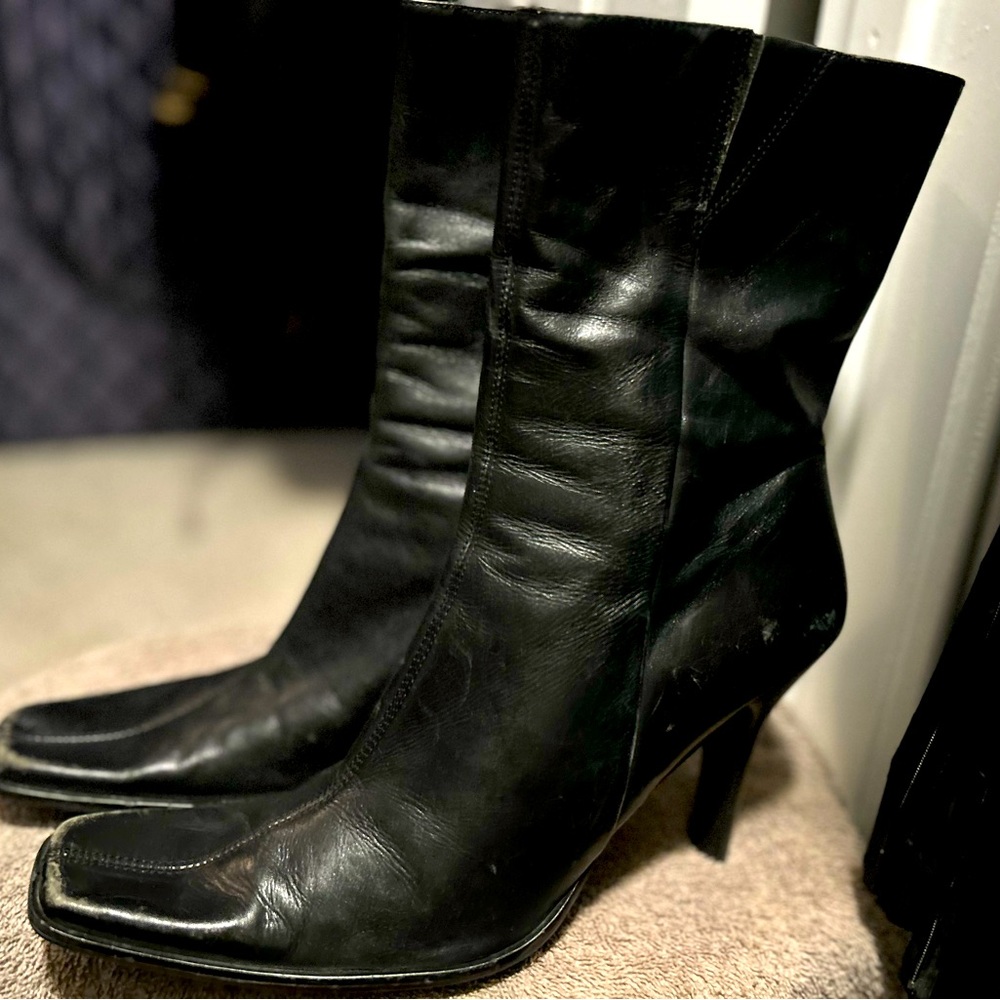 Black leather, high heeled mid boot. 11